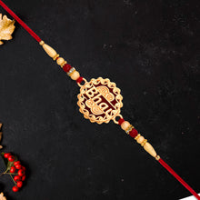 Golden Swastik Rakhi With Red Beads And Thread